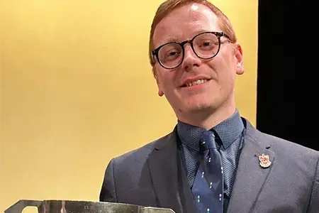 Lance Corporal Gareth Trott (pictured with trophy) (Band of the Welsh Guards) won Best Musical Director with Staines Brass in the Second Section. Gareth has also been accepted onto British Army Music’s Bandmaster Course. Staines Brass reach the National Finals in York for the first time in 21 years.